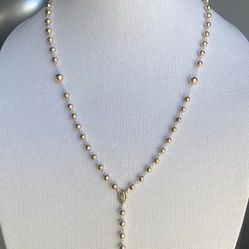 Silver 925 rosary necklace 10k gold laminated , length 25 inches , 21 grams weight .