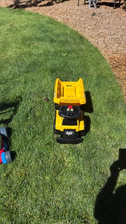 Toddlers ride on dump truck