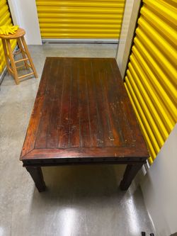 Rustic Solid Wood Coffee Table with Plank Top and Clavo Nailhead Detail