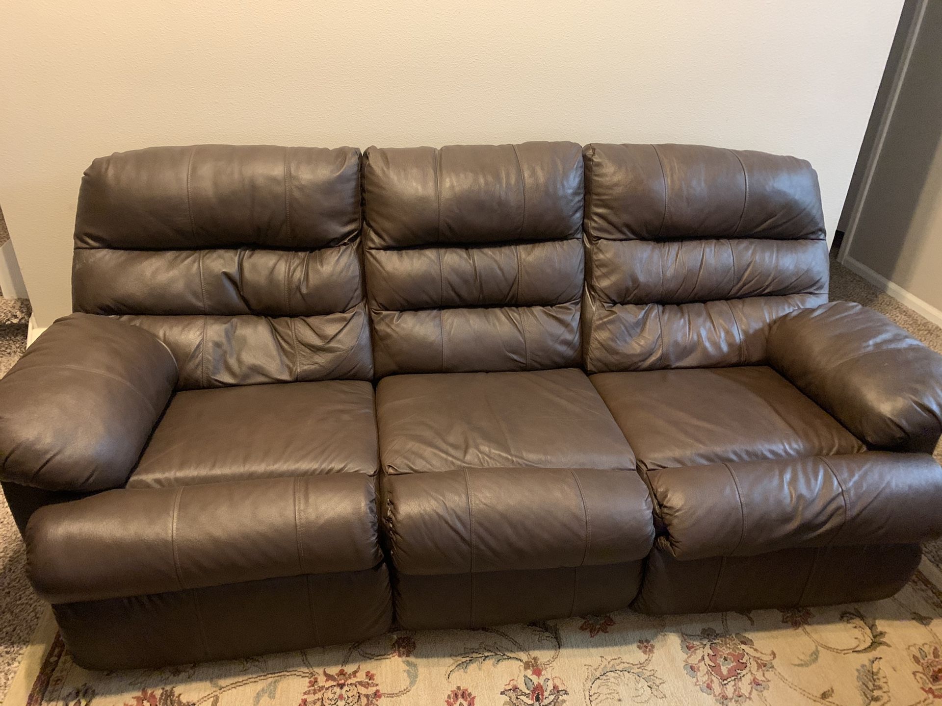 Leather reclining sofa in good condition! Comes with reclining chair