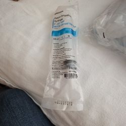 Piston irrigation syringe, flat top with catheter tip