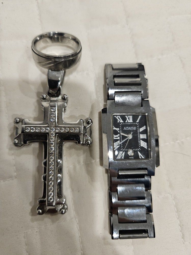 Silver watch and silver cross and ring.