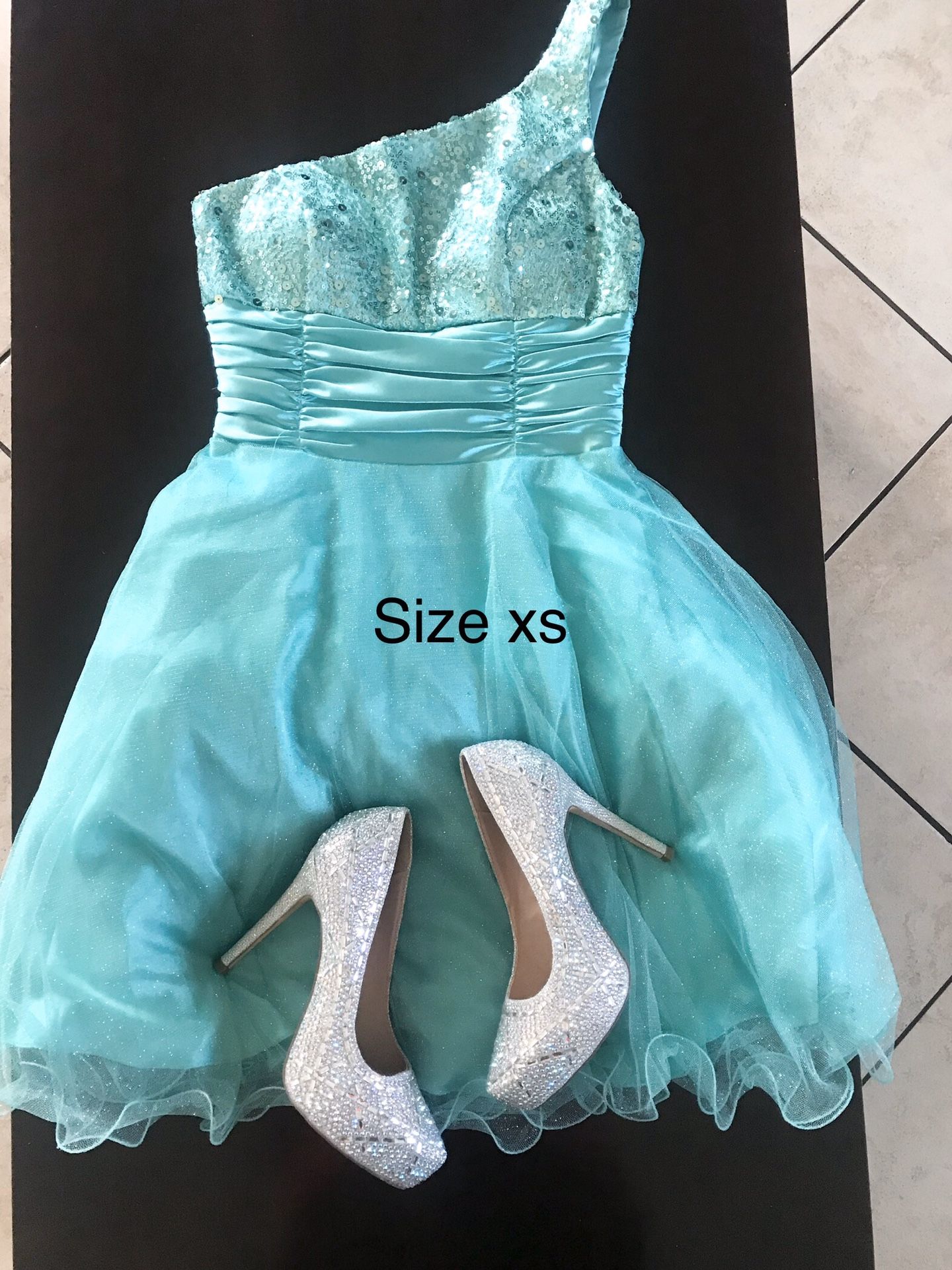 Prom dress and pairs of shoes