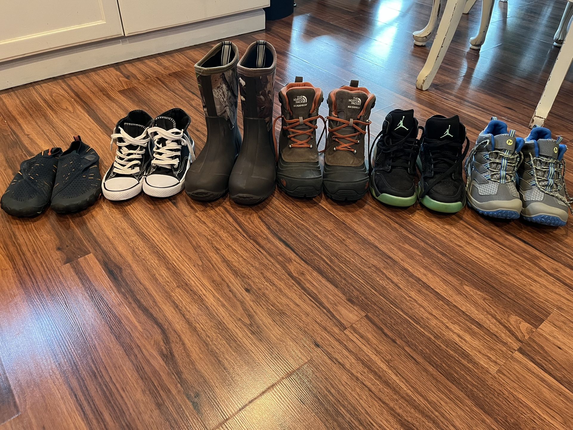 Boys lot- Nike Air Jordan’s, Camo Rain Boots, Merrell hiking boots, North Face waterproof hiking boots, Under armor pants