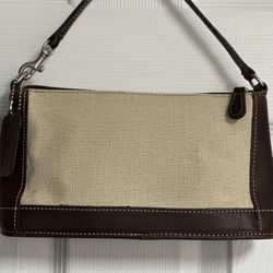 Authentic Coach brown leather and beige wristlet.