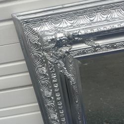 Large wooden framed silver bevelled mirror..  53” x 43” … $300