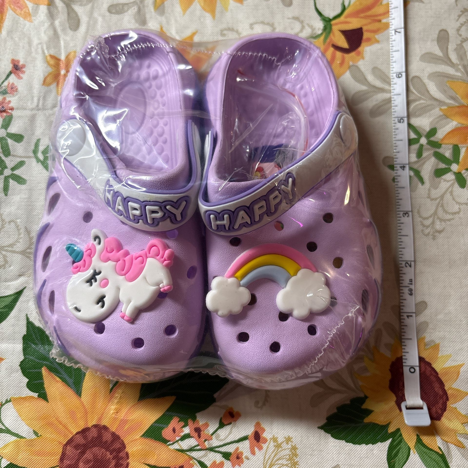 Purple Crocs Classic Clogs with rainbow unicorn design