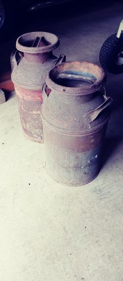 2 vintage milk containers