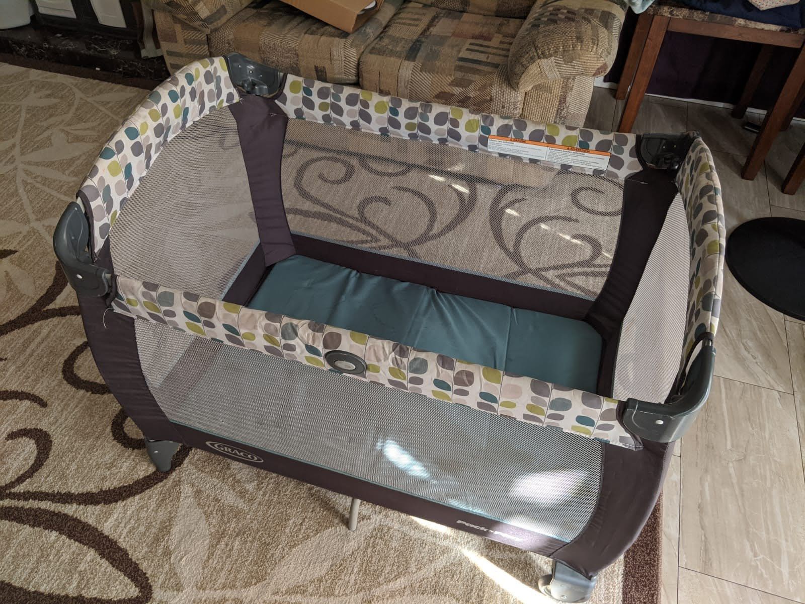 Playpen , Teal And Gray Color , With Brand New Bassinet , Has One Small Hole Which Can Easily Repair 