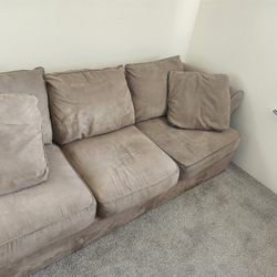 2 Piece Sectional Couch With Throw Pillows..asking 100 O.B.O