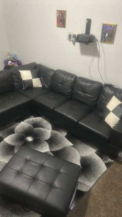 Black leather couch with ottoman