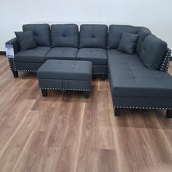 New 3pc Sectional In Charcoal With Storage Ottoman 