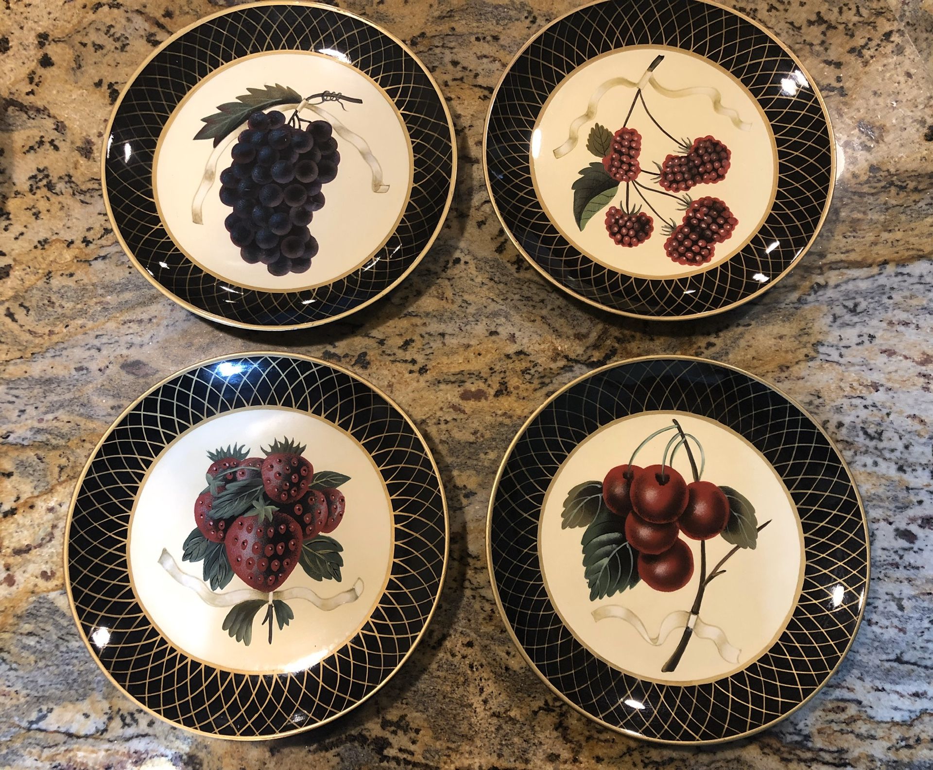 Raymond Waites Collectible decorative set of four dinner plates kitchen fruit black gold
