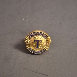 Toastmaster International Lapel Or Hat Pin Featuring A Goldtone Design W/Blue Enamel & Metal Backing - Looks New