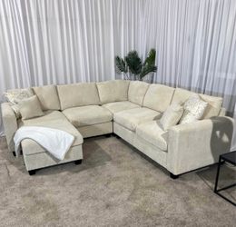 Ivory cream corduroy sectional sofa with ottoman