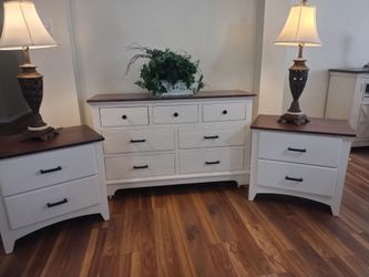 Two night stands in a dresser and two lamps
