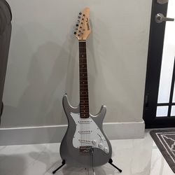 electric guitar with stand and case