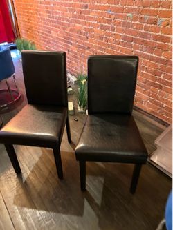 Two black dining chairs