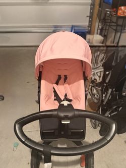 Pink stokke xplory stroller