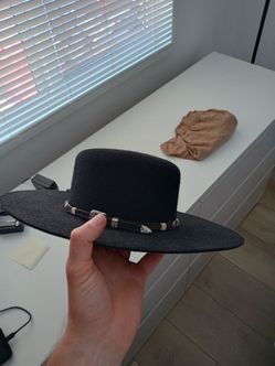 vintage western felt cowboy hat featuring branding from "J. Hornaday Dry Goods" and "Rodeo King Hat Company".