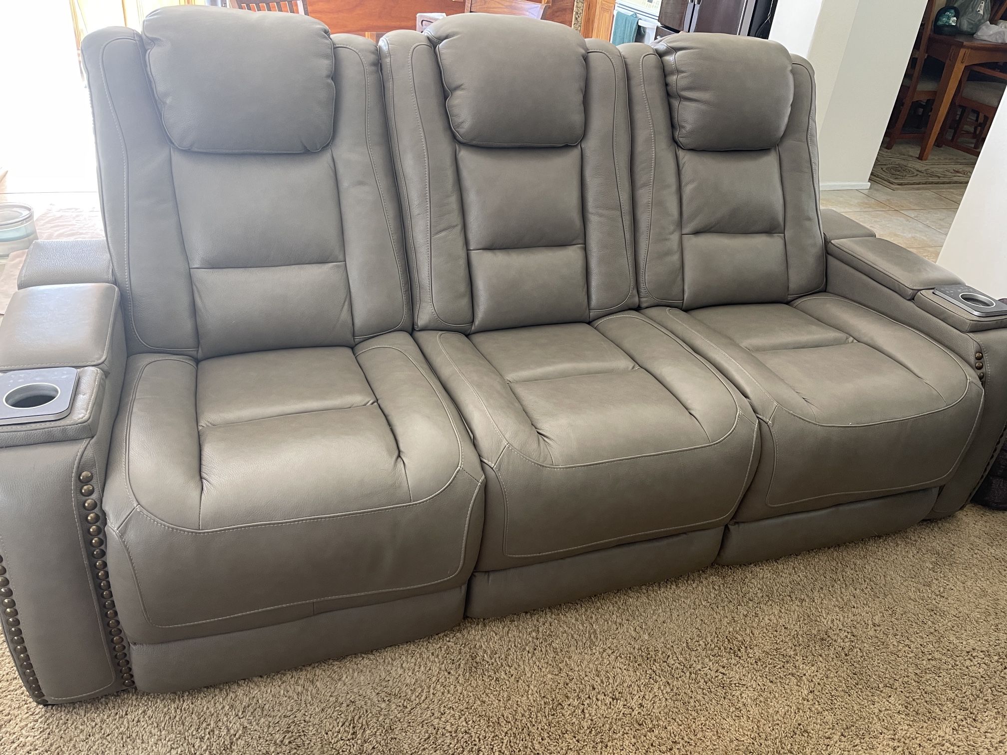 2- Leather Motion Reclining Sofa $699.00 ea
