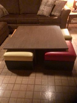 Mid Century Modern Retro table with rolling slide under ottoman chairs