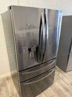 LG black stainless steel 4 door French door fridge with extra door in door warranty included