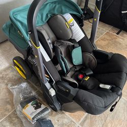 Doona+ Infant Car Seat & Stroller + LATCH Base – Desert Green | Lightly Used