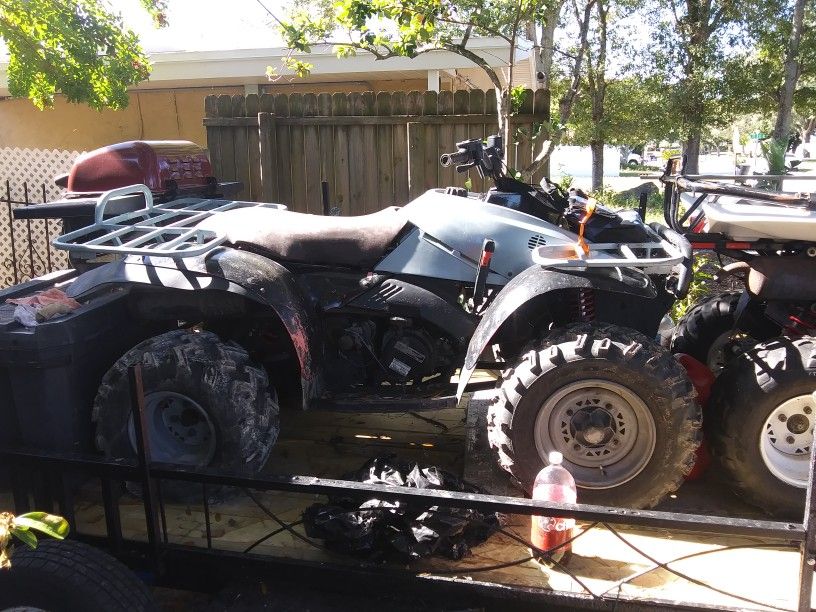 2 Atvs and trailer.polaris 2005 Traiblazer 250,polaris 1997 Trailboss