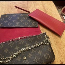 Louis Vuitton shoulder bag with a gold chain strap.