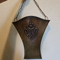 Cute metal flower holder or can be used. Anything you would like?