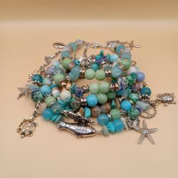 Bohemian Mixed Metal White Coral, Amazonite, Turquoise. and Blue Sodalite Bracelet StackExperience a tranquil journey with our 6.5 inch Bohemian mixed