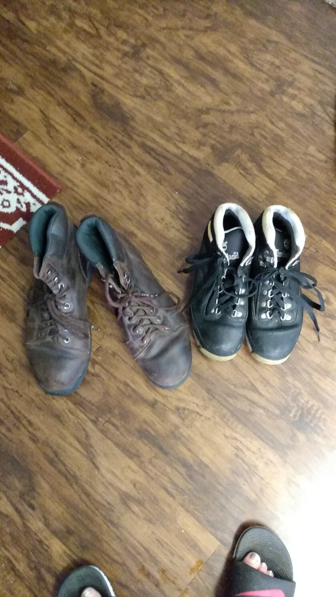 2 PRS of Work Boots, 1 is made by: Wolverine Sz.11 n 11.5 And the other or is made By: Timberland Sz. 8.-8.5