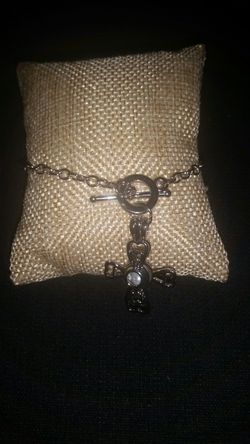 Cross with pearl bracelet