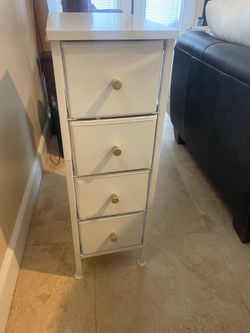 Small narrow dresser with 4 fabric drawers
