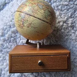 Business card drawer with rotating globe