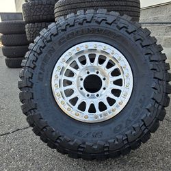 17" KM445 IMPACT FORGED beadlocks w/ 35x12.50R17 Toyo Open Country MT Tires