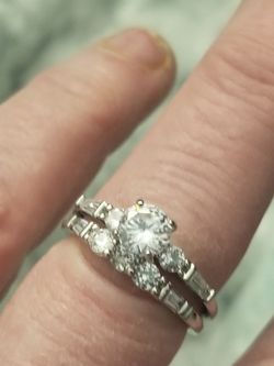 Stainless steel 2 piece wedding set with white cz's. Size 8