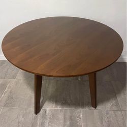 44” Round dining table in hazelnut