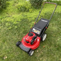 Troy-Bilt TB110 Push Lawn Mower. Red color with a black grass catcher bag. Runs great for keeping your yard tidy.  All sales are AS-IS, WHERE-IS Todas