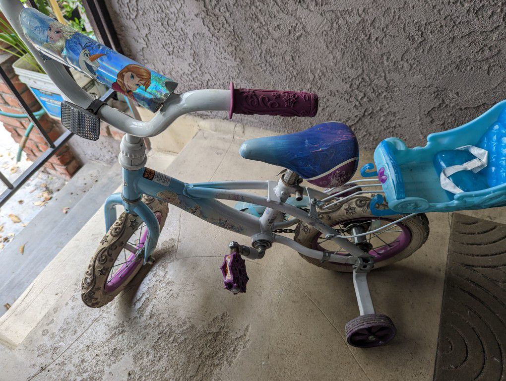 Girl Frozen Bike With Helmet.
