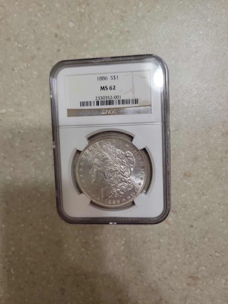 1886 Morgan Silver Dollar. Graded
