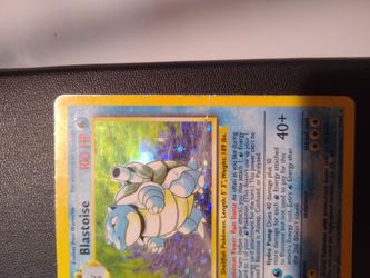 Heavily played Base set holofoil Blastoise pokemon card
