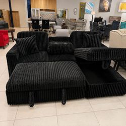 Black jumbo corduroy sectional sleeper sofa with pull out bed