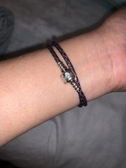 Dark purple Pandora leather bracelet.