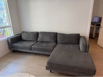 Living Spaces Aries Sectional. Dark Grey. Used Condition.