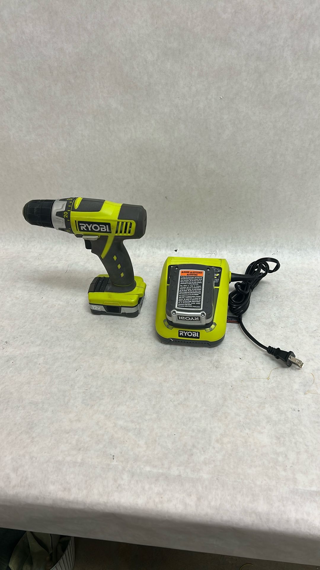 Ryobi 12 V drill with two batteries and charger