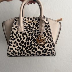 Black and white Michael Kors and bag , strap included