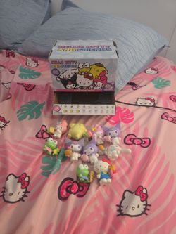 Hello kitty and friends figures ( not a complete set) 10 figures + box and packets
