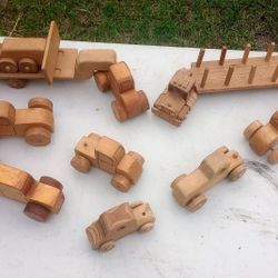 box of old wooden toy trucks